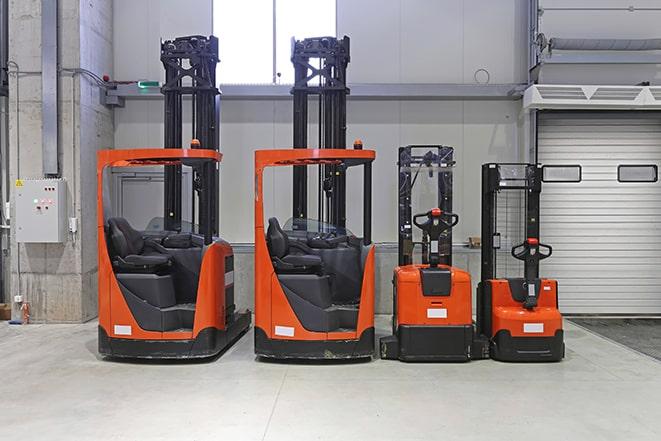 forklifts moving pallets of materials